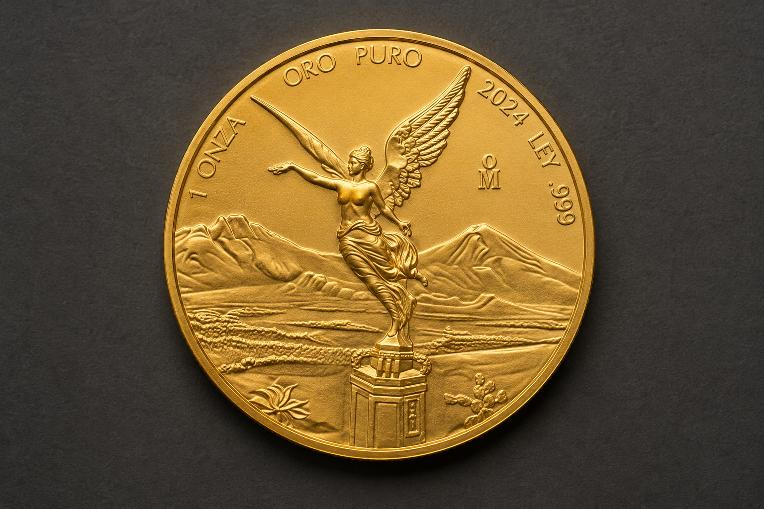 1 troy oz Mexican Gold Libertad bullion coin, reverse showing the Winged Victory statue with Popocatépetl and Iztaccíhuatl.