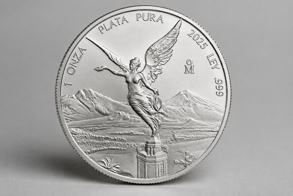 1 troy oz Mexican Silver Libertad bullion coin, reverse showing the Winged Victory statue with Popocatépetl and Iztaccíhuatl volcanoes.